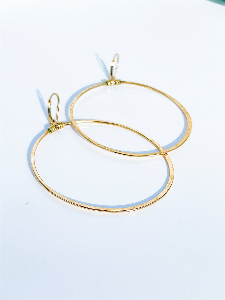2 1/2" X 1 1/2" Dainty, oval hoop earrings that hang down from a lever back ear wire 